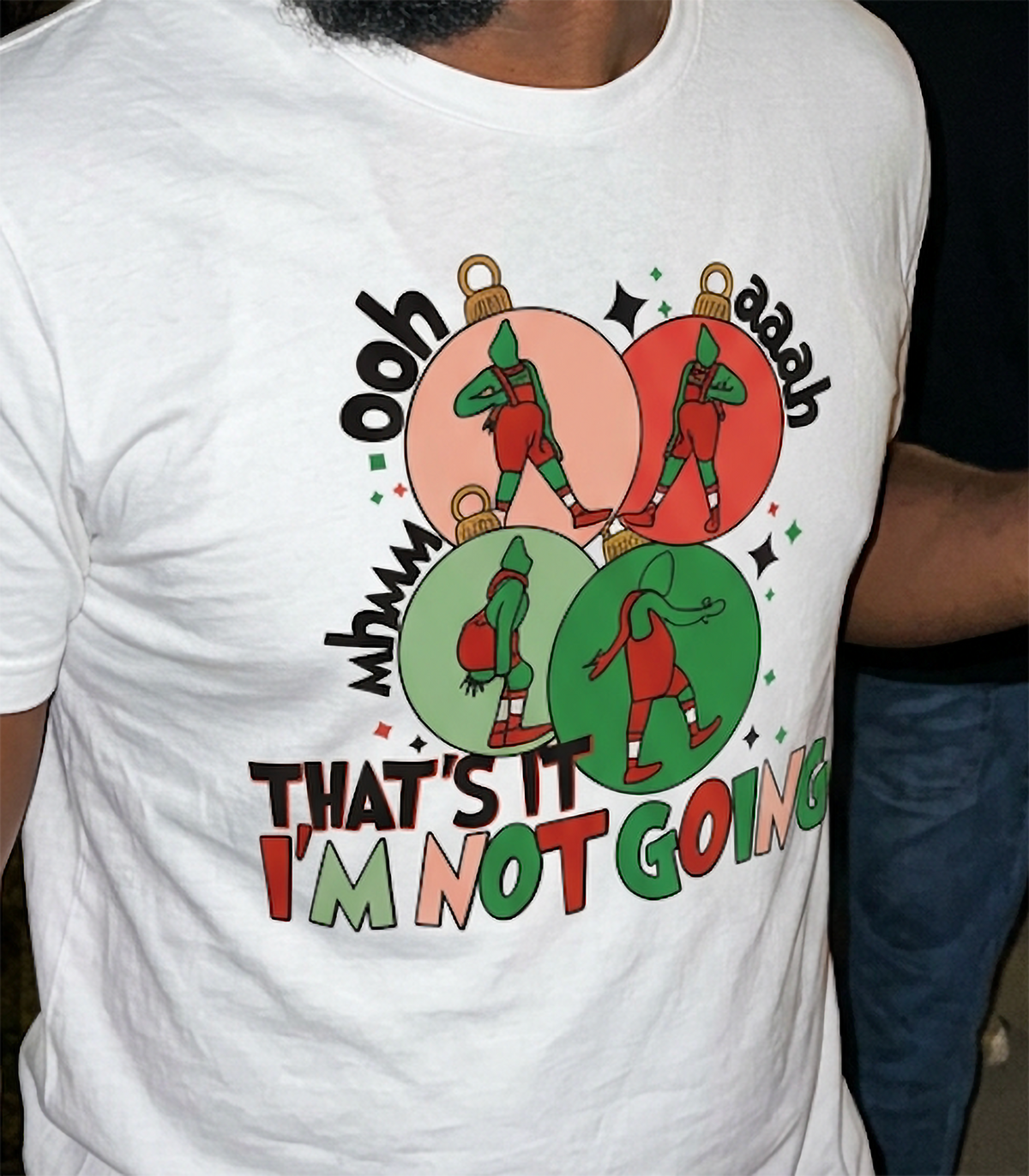 White Close-Up: Close-up of the That's It I'm Not Going Christmas graphic printed on a white shirt, featuring red and green ornaments.