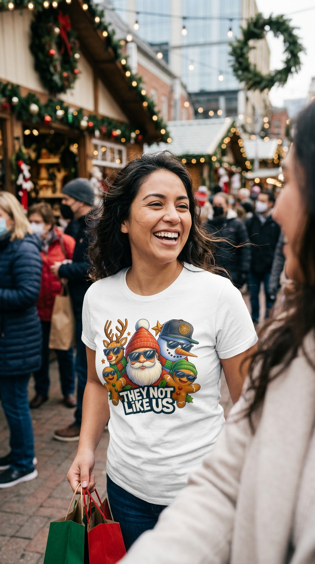 White Lifestyle: Woman wearing a white They Not Like Us Christmas t-shirt with a festive Santa, reindeer, snowman, and gingerbread graphic.