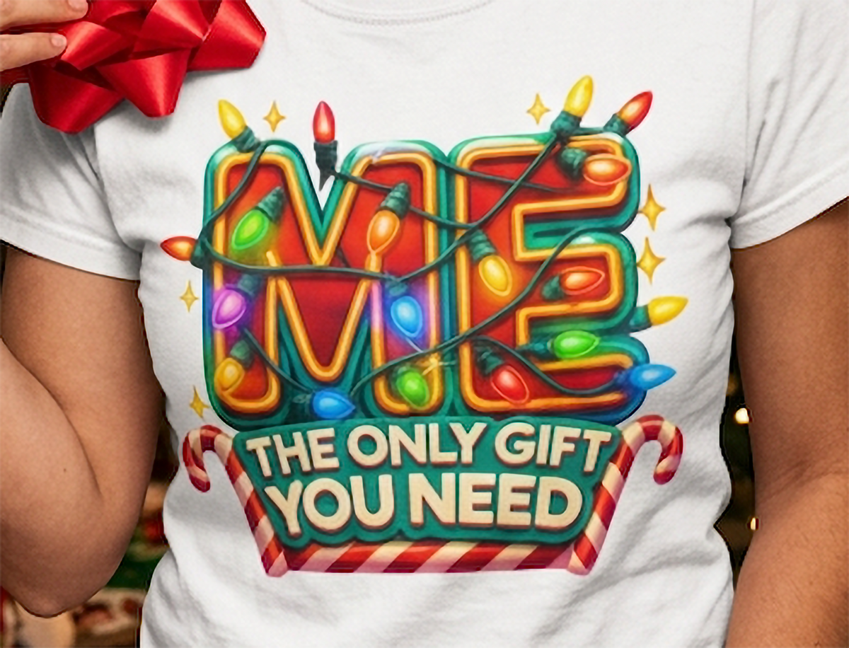 White Design Close-Up: Close-up of vibrant Christmas lights, candy canes, and Me The Only Gift You Need holiday graphic on white fabric.