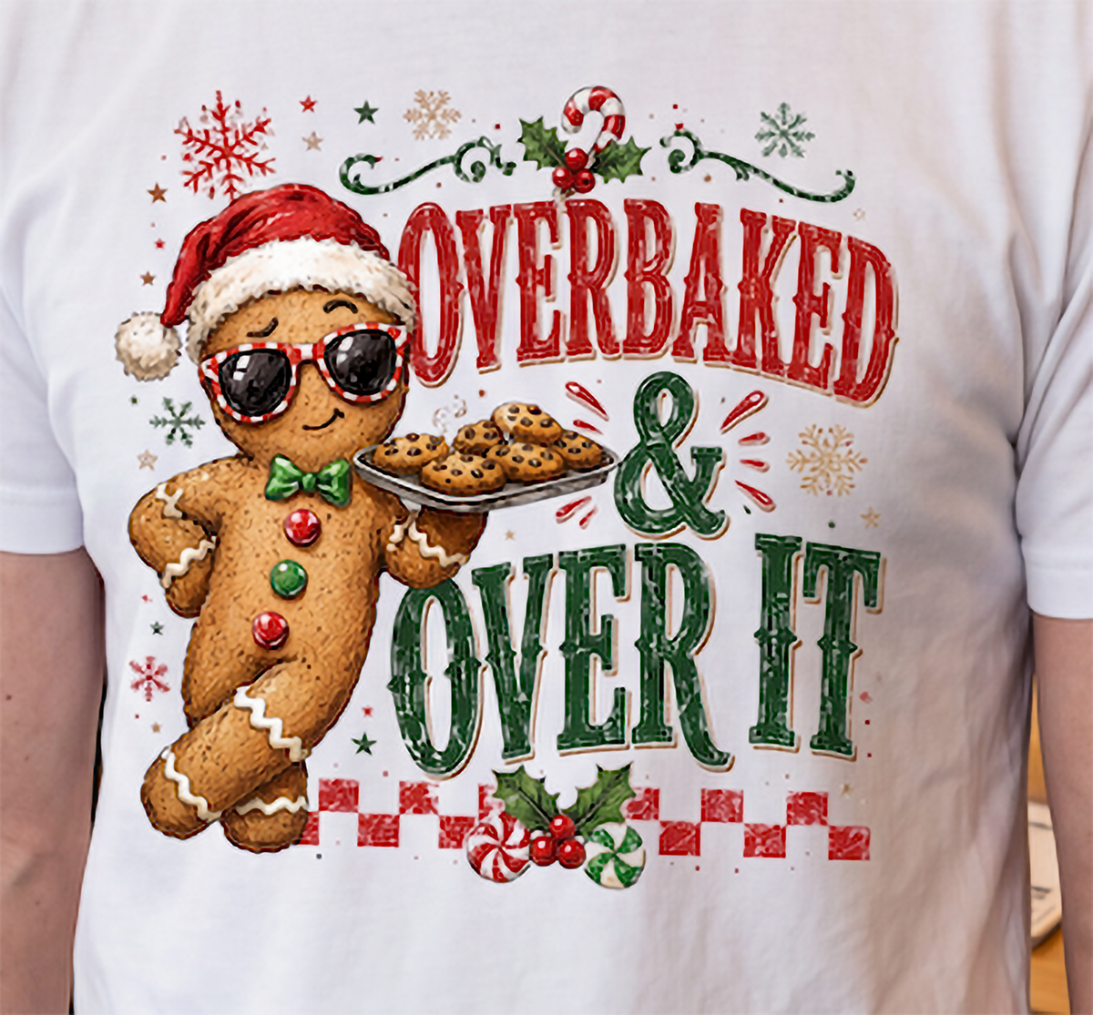 Close-up of funny Overbaked and Over It gingerbread Christmas graphic with cookies and holiday details.