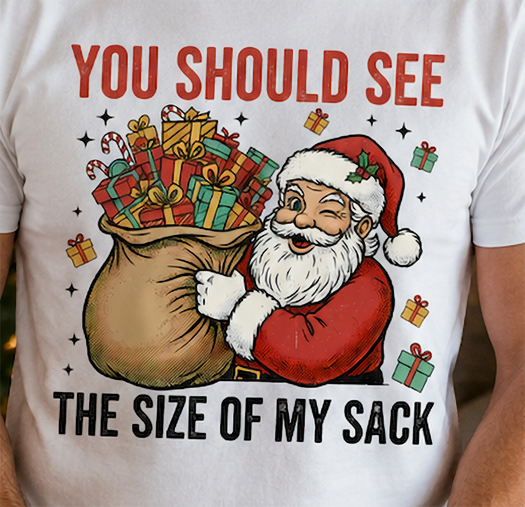 Close-up of funny Santa Christmas sack graphic displayed on a white holiday shirt.