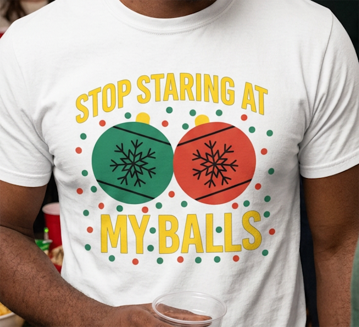 Close-up of white adult humor Christmas t-shirt featuring colorful ornaments and funny holiday graphic design.