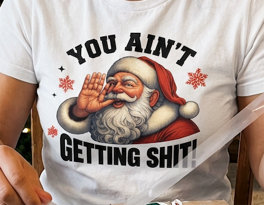 White Close-Up: Close-up of the funny You Ain't Getting Shit Santa Christmas graphic printed on a white t-shirt.