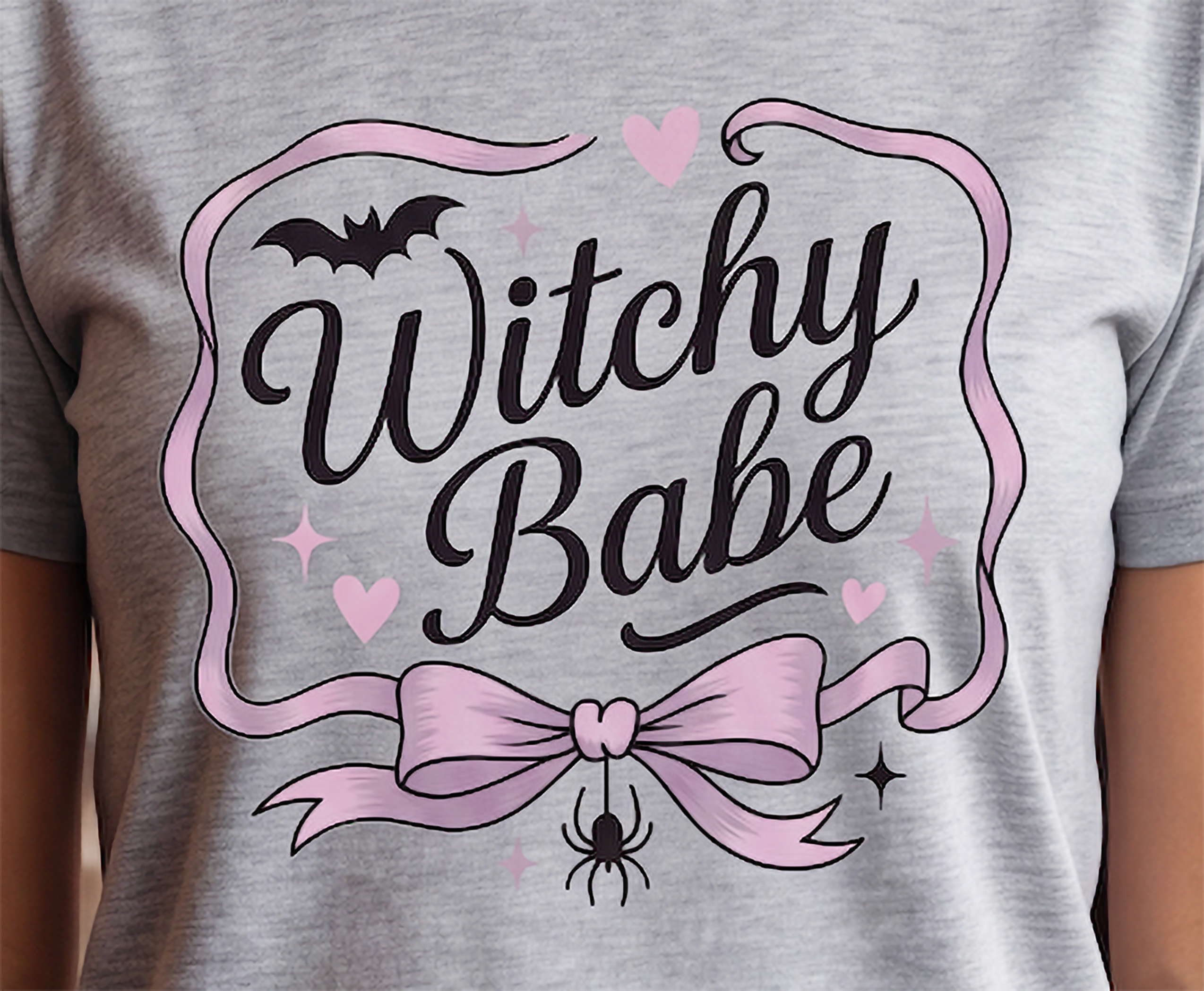 Close-up of Witchy Babe pink and black Halloween graphic printed on Heather Gray T-shirt